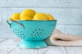 Fresh lemons in the colander Royalty Free Stock Photo