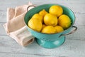 Fresh lemons in the colander Royalty Free Stock Photo