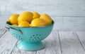 Fresh lemons in the colander Royalty Free Stock Photo