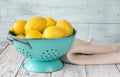 Fresh lemons in the colander Royalty Free Stock Photo