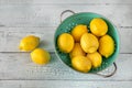 Fresh lemons in the colander Royalty Free Stock Photo
