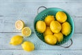 Fresh lemons in the colander Royalty Free Stock Photo