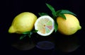 Fresh lemons with colorful pieces of fruit and peppermint