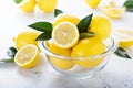 Fresh lemons in a glass bowl Royalty Free Stock Photo