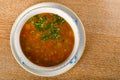 Fresh lentil soup in a white bowl, served in a restaurant setting, selective focus Royalty Free Stock Photo