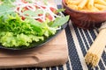 Fresh lettuce on a plate and a bunch of spaghetti Royalty Free Stock Photo