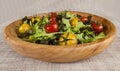 Fresh lettuce and red and yellow cherry tomatoes on a wooden tray Royalty Free Stock Photo