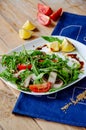 Fresh light salad with arugula , mushrooms, tomato in lemon-honey sauce. Healthy eating concept. proper nutrition Royalty Free Stock Photo