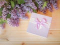 Fresh lilac flowers and gift box Royalty Free Stock Photo