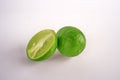 Fresh lime fruit cut with half Royalty Free Stock Photo
