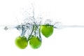 Fresh lime dropped into the water with water splash on a white b Royalty Free Stock Photo