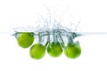 Fresh lime dropped into the water with water splash on a white b Royalty Free Stock Photo