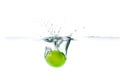 Fresh lime dropped into the water with water splash on a white b Royalty Free Stock Photo