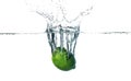 Fresh lime falling into water Royalty Free Stock Photo