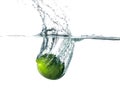 Fresh lime falling into water Royalty Free Stock Photo