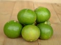 fresh lime fruit on wood background Royalty Free Stock Photo