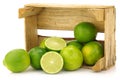 Fresh lime fruit in a wooden crate Royalty Free Stock Photo