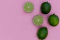 Fresh lime fruits on pink background summer food concept Royalty Free Stock Photo