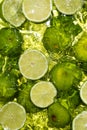 Fresh Lime Halves Floating in Water Top View Royalty Free Stock Photo