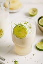 Fresh lime juice, lime zest and pineapple. Served in a glass and garnished with a slice of lime Royalty Free Stock Photo