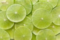 Fresh lime slices as a background. green background with citrus fruit of lime slices. Top view Royalty Free Stock Photo