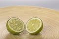 Fresh lime slices on wood plate Royalty Free Stock Photo