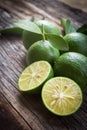 Fresh limes on wooden background. Royalty Free Stock Photo