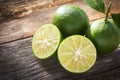 Fresh limes on wooden background. Royalty Free Stock Photo