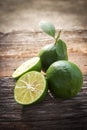 Fresh limes on wooden background. Royalty Free Stock Photo