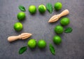 Fresh limes and wooden juicer Royalty Free Stock Photo