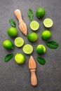 Fresh limes and wooden juicer on Royalty Free Stock Photo