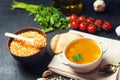 Fresh liquid pea soup on pork broth. bean soup with parsley. healthy breakfast. black concrete background. selective focus. Royalty Free Stock Photo