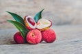 Fresh litchi fruit on an old wooden background Royalty Free Stock Photo