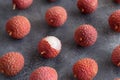 Fresh litchi fruits on a grey table Royalty Free Stock Photo