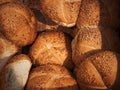 Fresh loaves of bread and buns in rustic bakery, baked goods on rustic background and countryside food market Royalty Free Stock Photo