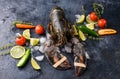 Fresh lobster, ice, vegetables, lime, sprigs of razmarin, dark look. A dark background, a place for text. Seafood healthy Royalty Free Stock Photo