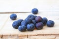 Fresh local blueberries macro shot on rustic wooden background