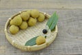 Fresh longan in basket on wooden table