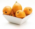 Fresh loquats medlars in bowl. Royalty Free Stock Photo