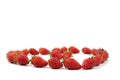 Fresh luxury Strawberry are disrupted in the group area with studio light on the white background