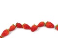 Fresh luxury Strawberry are disrupted in the group area with studio light on the white background