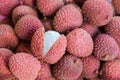 Fresh lychee fruits with one cut open in full frame Royalty Free Stock Photo