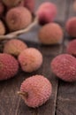 Fresh Lychees on wooden background