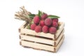 Fresh lychees in a wooden box