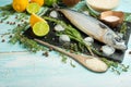 Fresh mackerel on a black slate stone with spices, herbs, lemon, lime and salt. Top view, space for copy Royalty Free Stock Photo