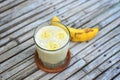 Fresh made Banana Milkshake on vintage wooden Royalty Free Stock Photo