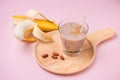 Fresh made Banana smoothie on pink background Royalty Free Stock Photo