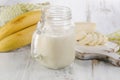 Fresh made Banana smoothie on a wooden background. Royalty Free Stock Photo