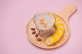 Fresh made Banana smoothie on yellow background Royalty Free Stock Photo