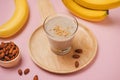 Fresh made Banana smoothie on yellow background